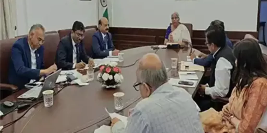 Union Finance Minister Nirmala Sitharaman leads a strategic meeting with senior banking executives and officials to assess preparedness against cyber threats, with the Indian national flag in the backdrop.