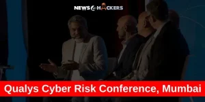 Panel discussion at the Qualys Cyber Risk Conference in Mumbai with cybersecurity experts on stage.