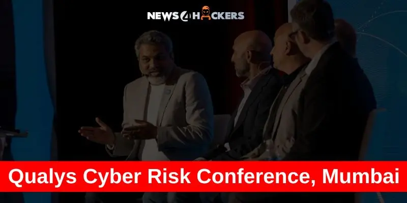 Panel discussion at the Qualys Cyber Risk Conference in Mumbai with cybersecurity experts on stage.