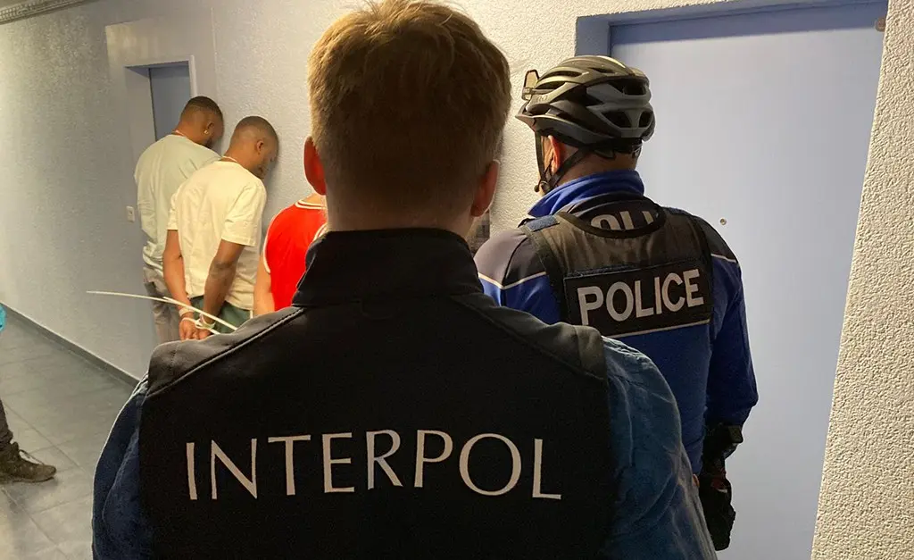 Image Shows interpol arrest cybercrimals 