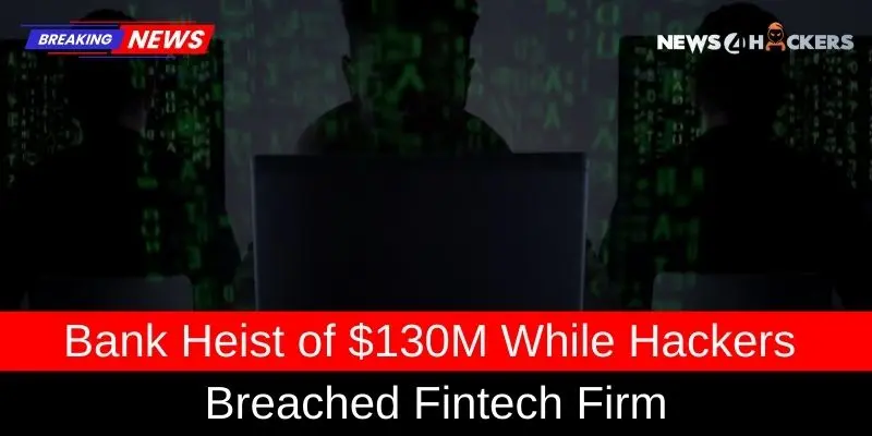 Silhouettes of hackers in front of computer screens with green code, illustrating a $130 million bank heist via a fintech firm breach.