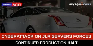 A Jaguar XJ L car in a production facility with a news headline about a cyberattack on JLR servers leading to a production halt.