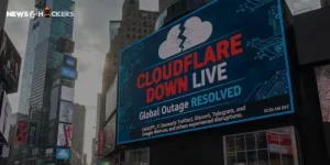 Digital billboard in a city showing “Cloudflare Down Live” with message about global outage resolved and major platforms affected.
