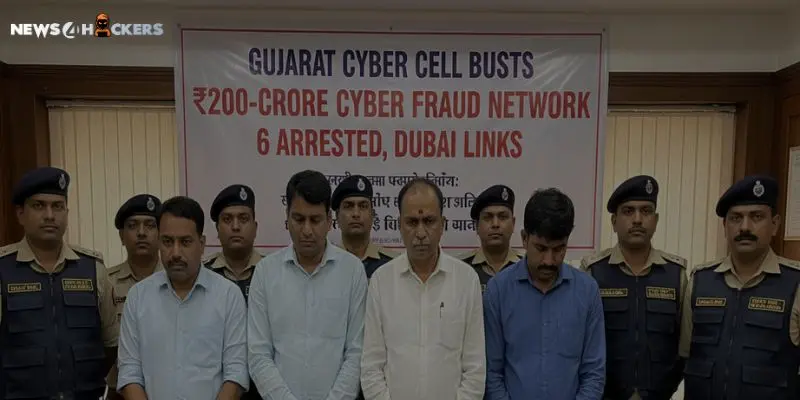 Group photo showing six arrested suspects standing with police officers in front of a banner announcing Gujarat Cyber Cell’s ₹200-crore cyber fraud bust with Dubai connections.