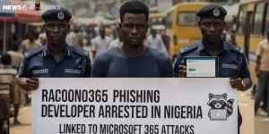 Nigerian police officers with a suspect holding a banner saying “Racoon0365 phishing developer arrested in Nigeria,” linked to Microsoft 365 attacks.